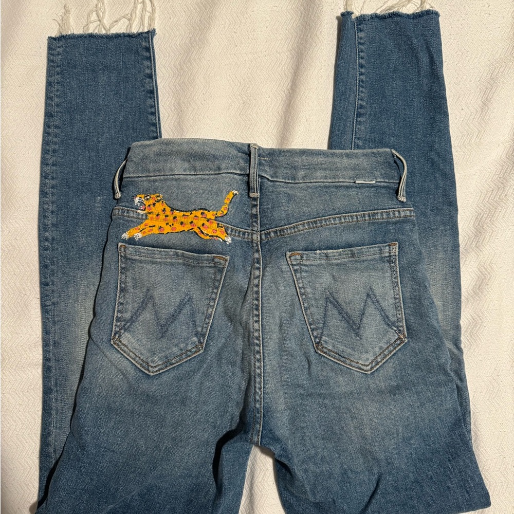 Mother high waisted medium wash skinny jeans with leopard sketch on back